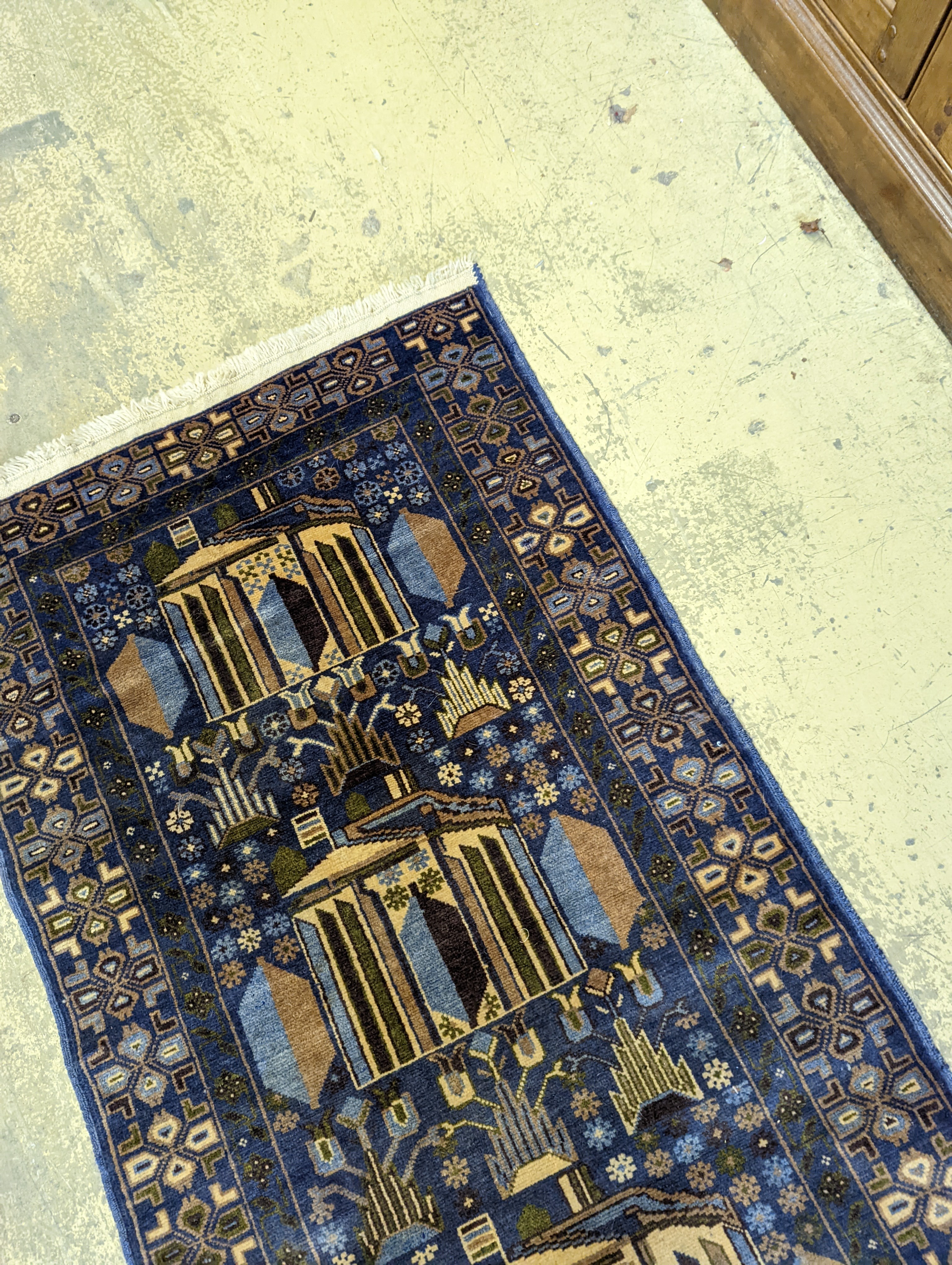 A Caucasian design blue ground rug, 145 x 84cm